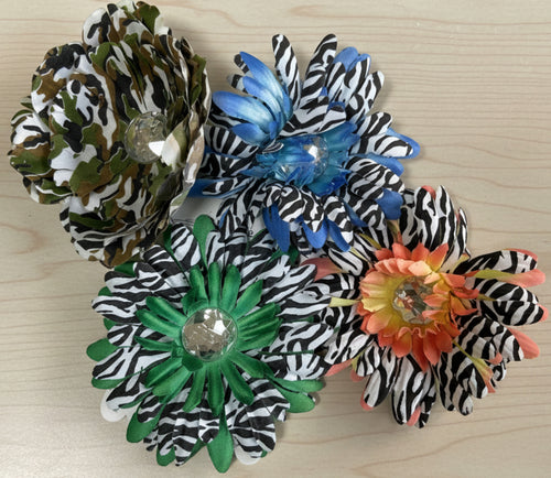 Decorative flowers with zebra print petals on a green textured background