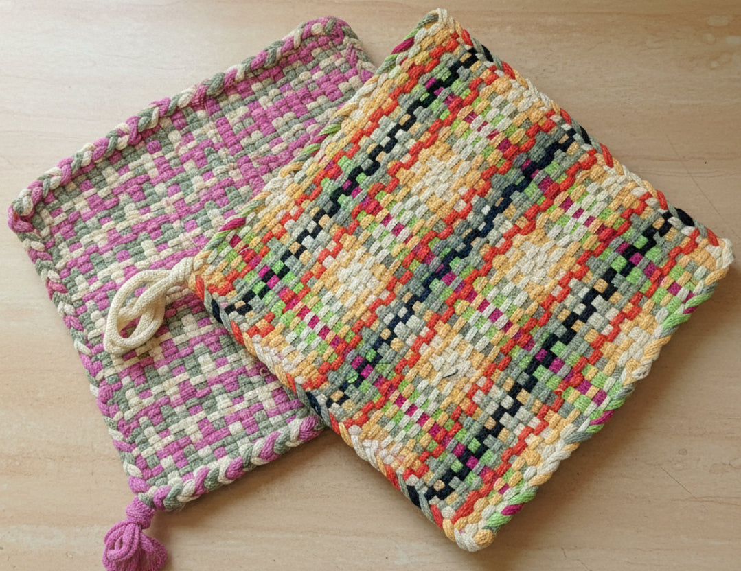 Colorful woven bag on a textured surface with a blurred background
